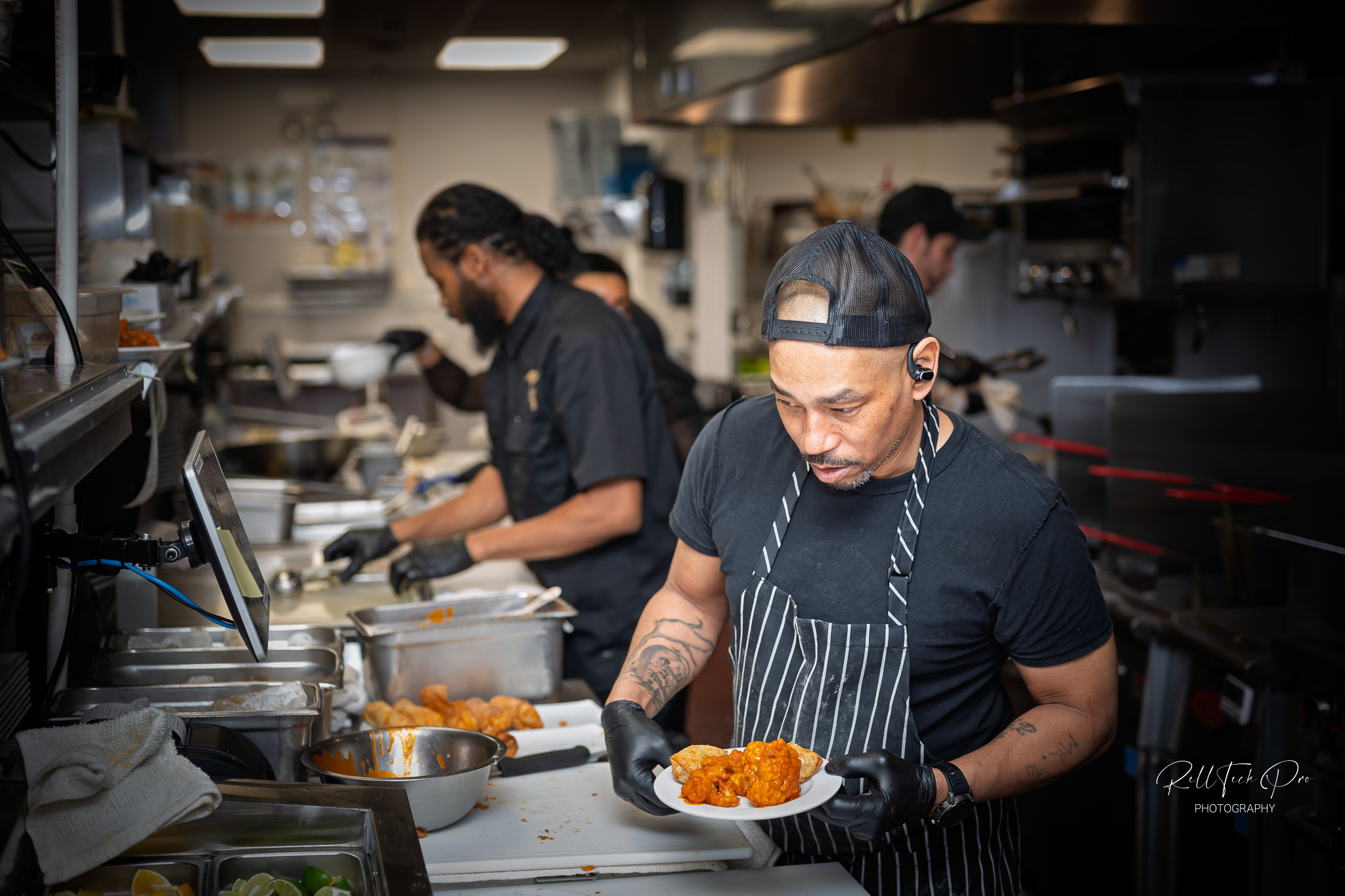 Revel Supper Club Kitchen and Chefs prepping food for the family and friends night